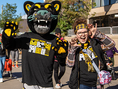 Image of Pounce Panther and a participant