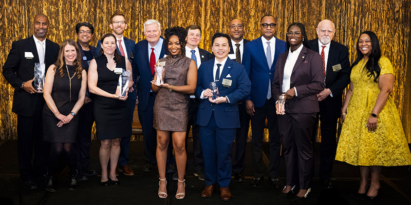 2026 Awardees pose on stage