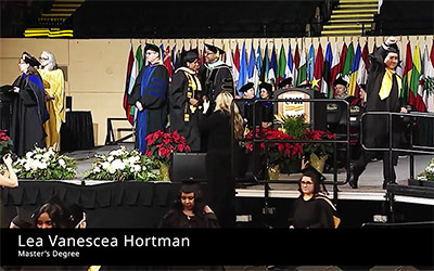 StageClip thumbnail image of a graduate receiving their diploma on stage at graduation