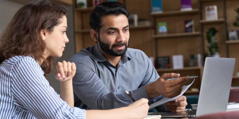 Two professionals in a one-on-one consultation session, with a focus on strategic planning and personal development, ideal for individual consult services.