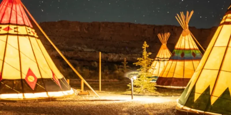 wigwams bathed in warm light