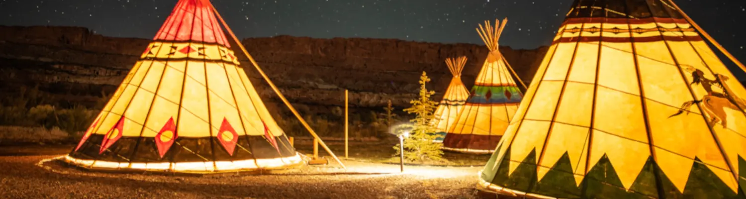 wigwams bathed in warm light