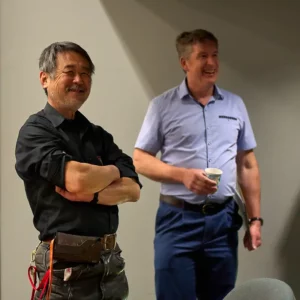 Two faculty members laughing and smiling