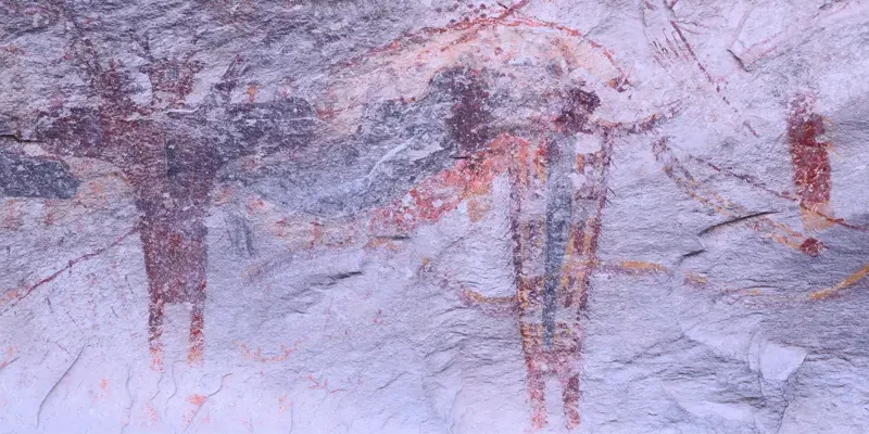 crude drawings on cave wall
