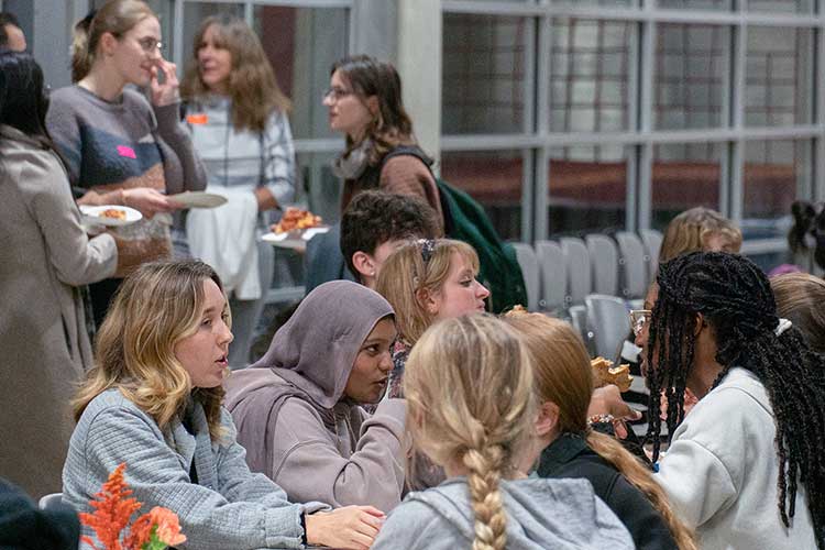 Female architecture students gather at a lunch event.