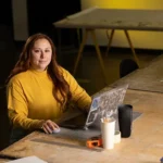 UWM student Dulce Carreno sits with her laptop open in front of her