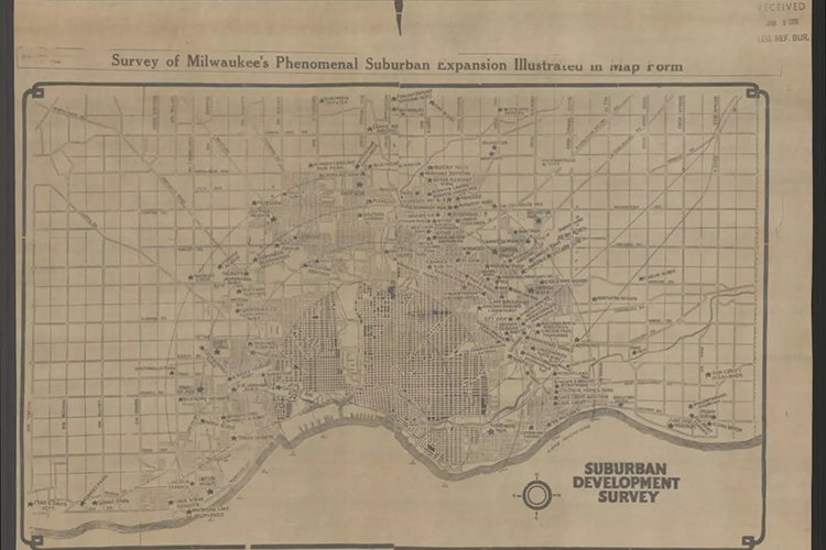 A beige map outlining many lines and locations of Milwaukee's urban expansion. In the lower right corner are the words, "Suburban Development Survey" in bolded text and a simple diagram of a compass. At the top of the page are the words "Survey of Milwaukee's Phenomenal Suburban Expansion Illustrated in Map Form".