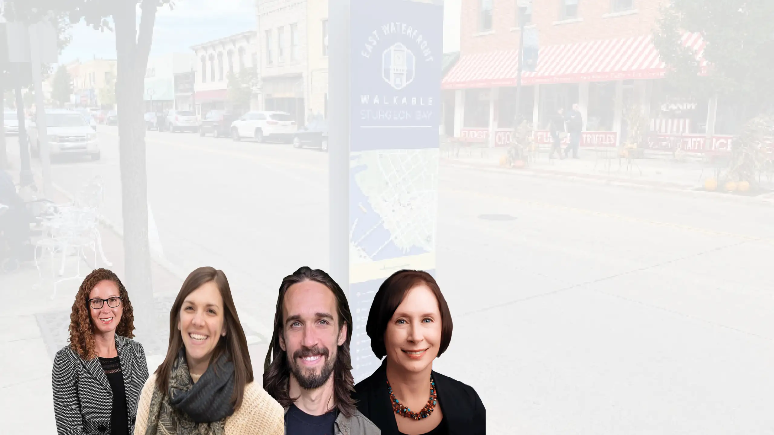 Four professional headshots arranged over a faded downtown street scene with an “East Waterfront Walkable Sturgeon Bay” sign in the background.