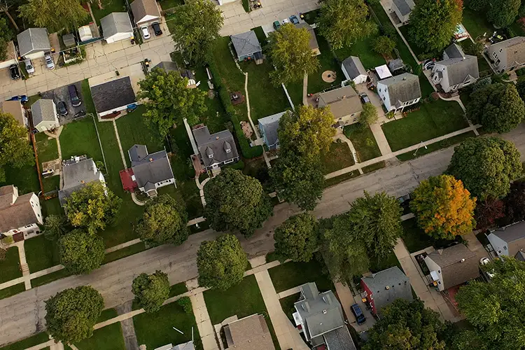 An aerial view of a Midwestern neighborhood in the evening.