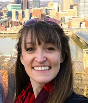 Headshot of Lindsey Carter in front of a river.