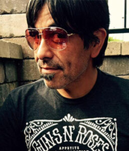 Headshot of Louis Molina in sunglasses.