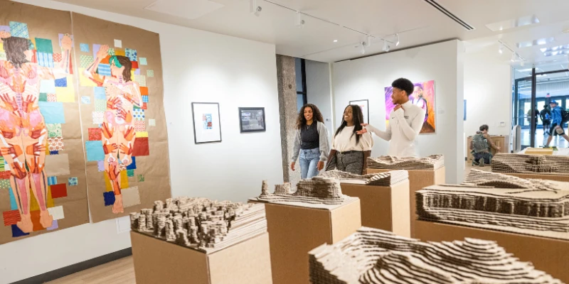 people standing in a gallery