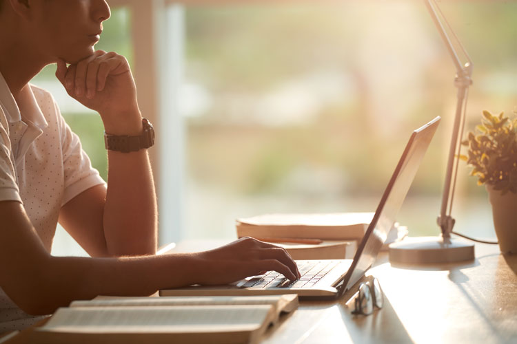 person viewing laptop