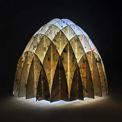 A structure comprised of several pieces form a dome.