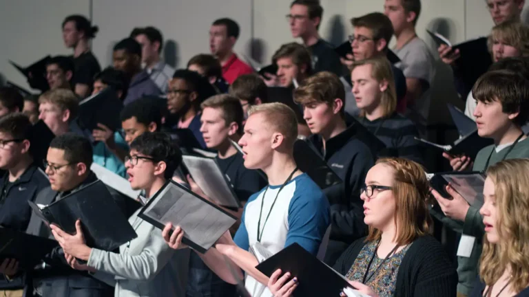 A diverse group of students singing together at the UWM Vocal Arts Festival.
