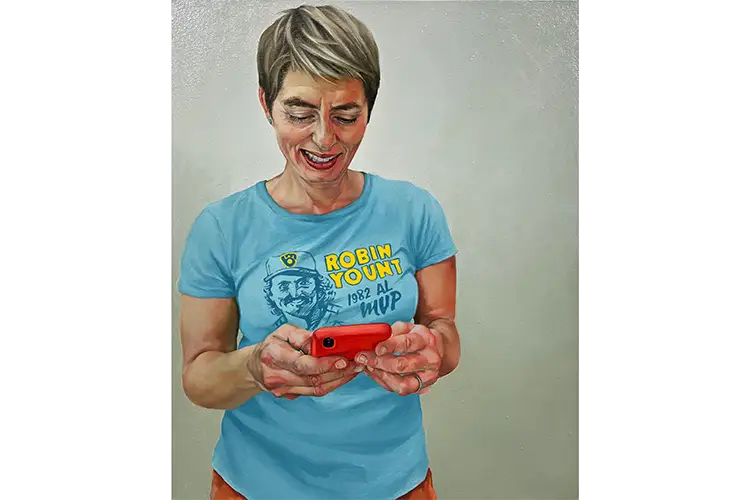 Sara Amy-O'Neill RECENT WORK Painting of a person wearing a blue Robin Yount MVP t-shirt, holding a red smartphone against a plain background.
