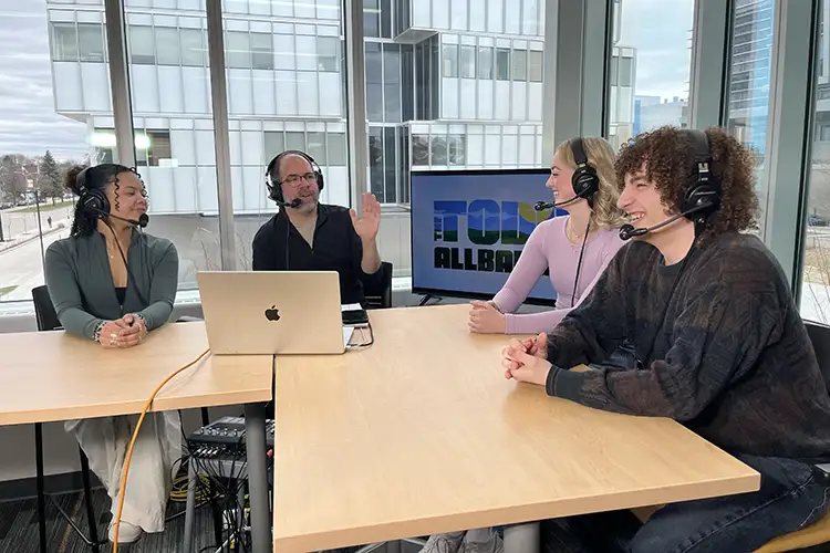 Students talk with radio show host at UW-Milwaukee.