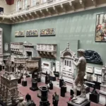 Large gallery filled with classical sculptures, architectural casts, and reliefs displayed in a spacious museum hall.