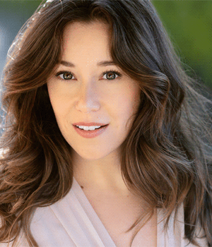 Headshot of Emily Vitrano outdoors.