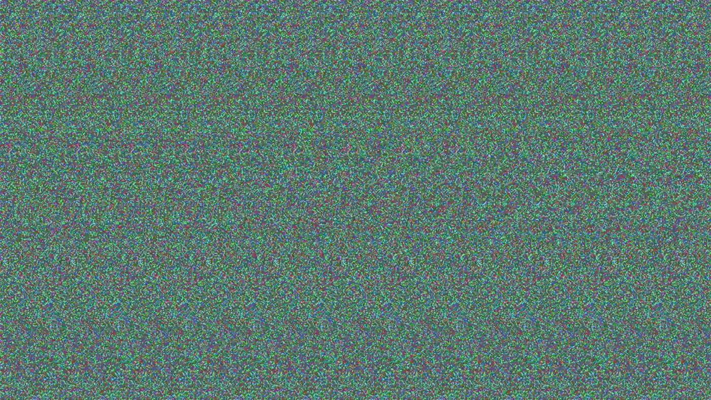 Colorful static pattern resembling digital noise or a stereogram image.