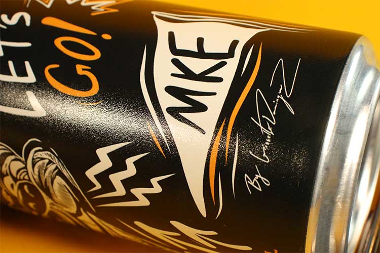 The signature of designer Gisselle Dominguez graces the can.