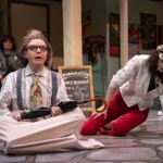 Actors in costumes perform in a scene of Scapino.