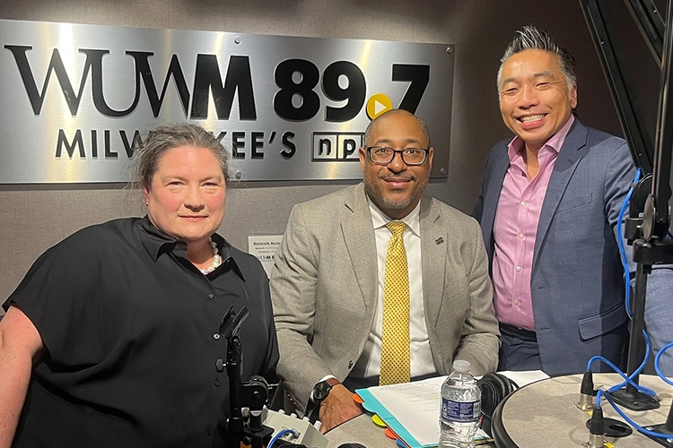 Dr. Winifred Elysse Newman and Chancellor Mike Gibson pose with WUWM 89.7's David Lee