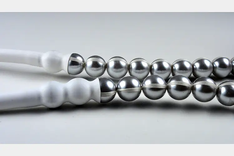 circular chrome balls connected with cording, the last two in both rows is covered in plastic circular chrome balls connected with cording, the last two in both rows is covered in plastic
