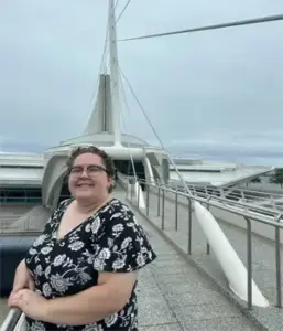 Headshot of Faith Puppala in front of the Milwaukee Art Museum.