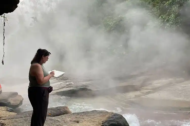 Rutherford draws in front of the Boiling River.