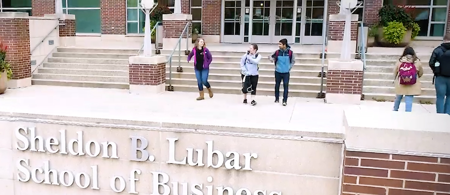 Students walking in front of Lubar Hall.