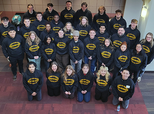 Group of students wearing Accounting Survivors sweatshirts