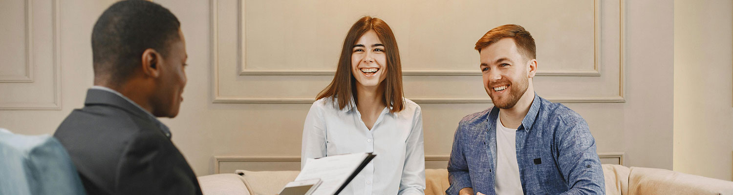 Three people laughing.