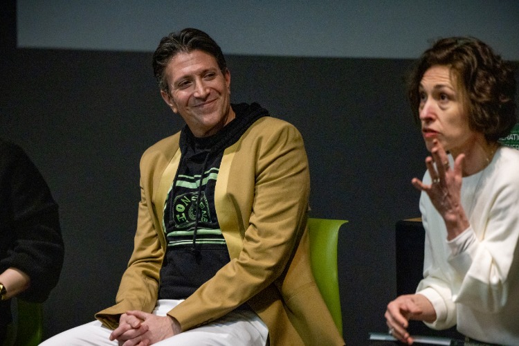 Panelist Nathaniel Stern looks at panel moderator Charlotte Kent during Generations and Generativity: Post-AI Aesthetics in Practice--a panel discussion that was part of C21's Aesthetics, Art, & AI program series.