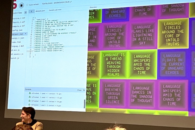 Poetry generated by Sasha Stiles is projected onto a wall during the Language as Collaborator: Co-Creating with Thinking Machines workshop, part of C21's Aesthetics, Art, & AI program series. Poetic phrases appear inside the squares of a grid, on a split screen that also shows the code that generated the poetry.