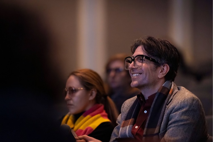 An audience member smiles during Kite's artist talk, part of C21's Aesthetics, Art, & AI program series. An audience member smiles during Kite's artist talk, part of C21's Aesthetics, Art, & AI program series.