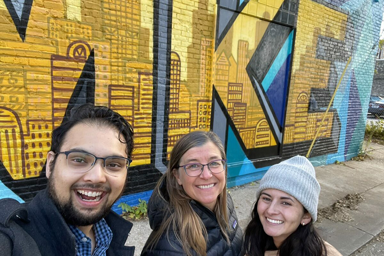 Students and instructor near a Milwaukee mural