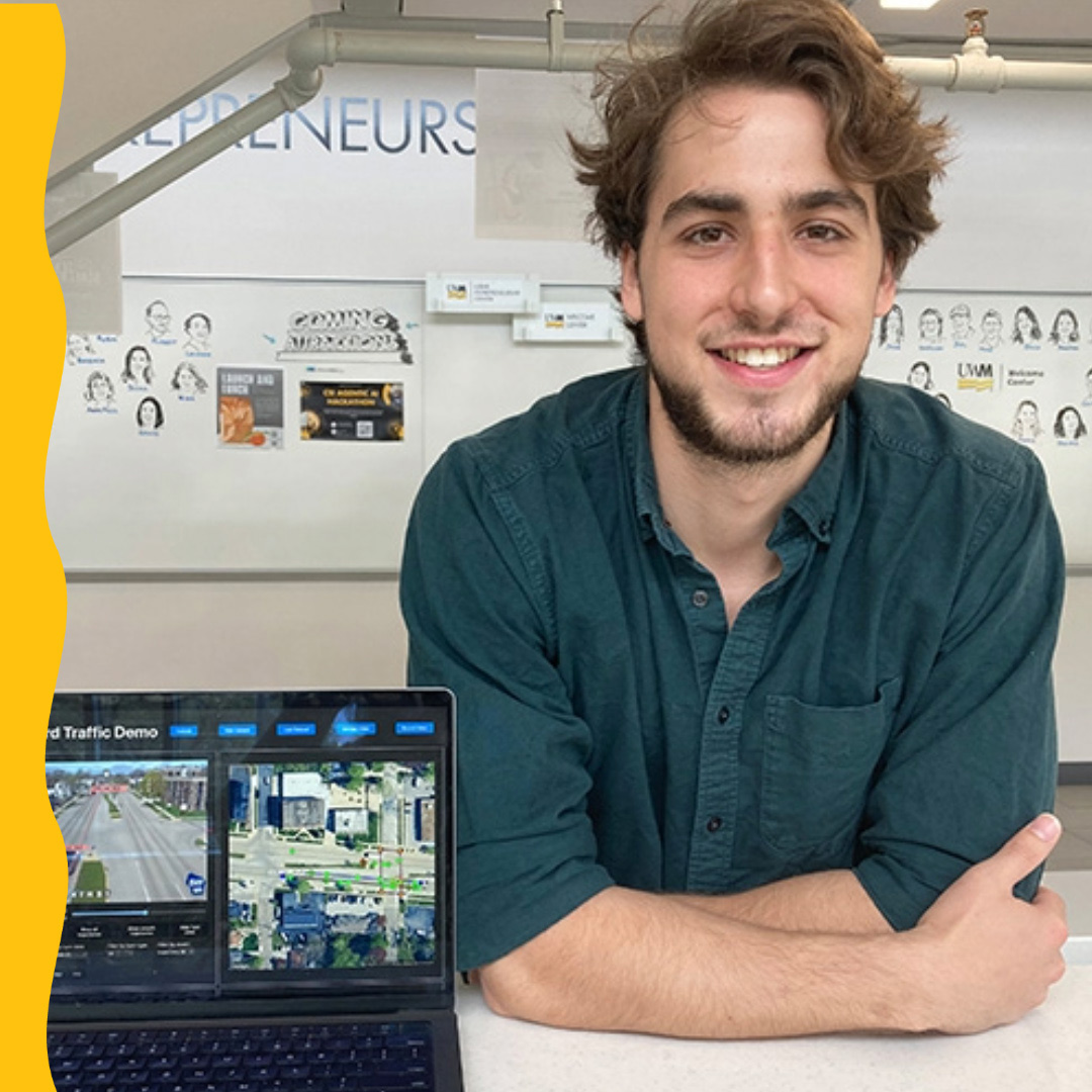 Joel Roberts with laptop in Lubar Entrepreneurship Center.
