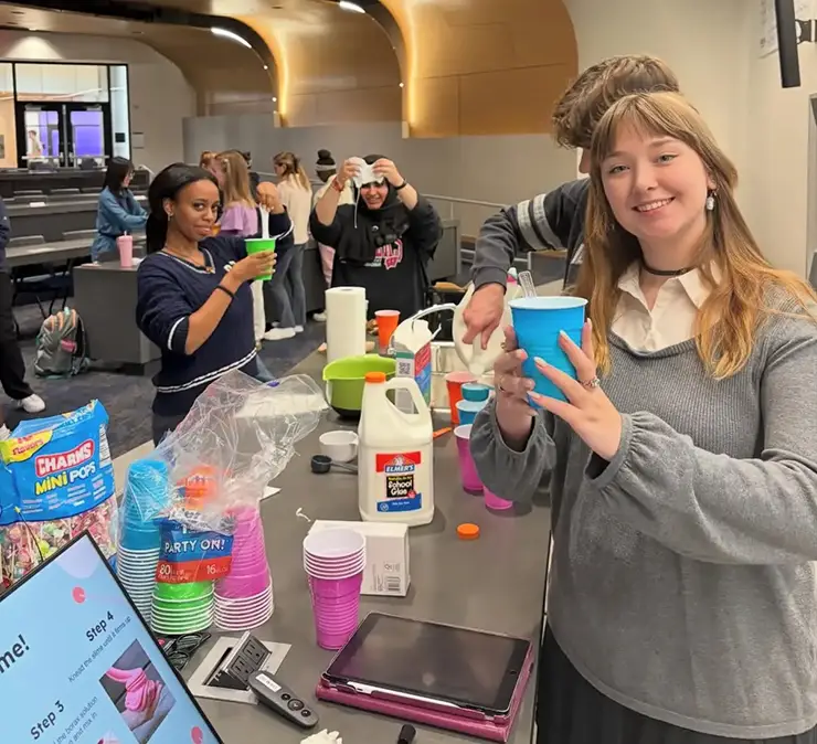 A group of Chemistry Club students making slime