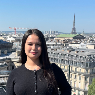 Study abroad student in France with Eiffel Tower in background