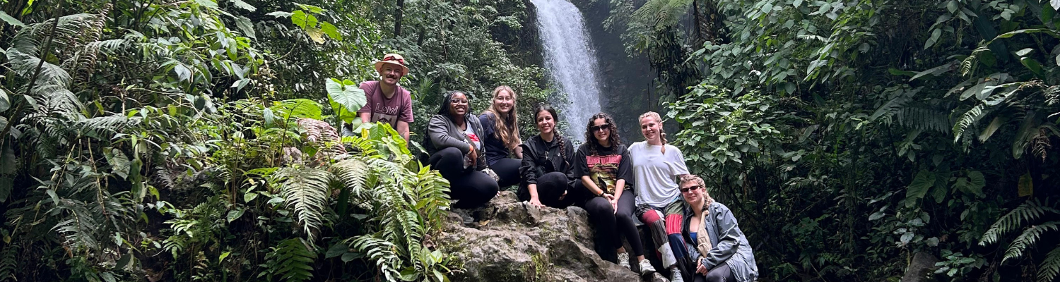 Study abroad students in front of a Costa Rica waterfall