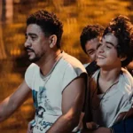 three people on a scooter