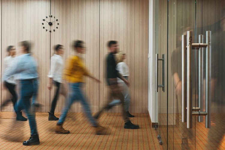 people walking through doors