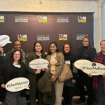 2024 WLC Scholarship recipients standing in front of a UWM School of Continuing Education banner.  