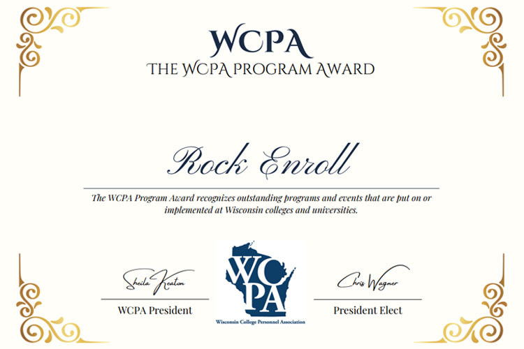 Ivory certificate with decorative gold scrolls in each corner. The certificate is from the Wisconsin College Personnel Association (WCPA).