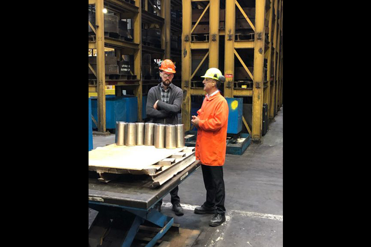 Two men touring the facilities at ATI Forged Metals