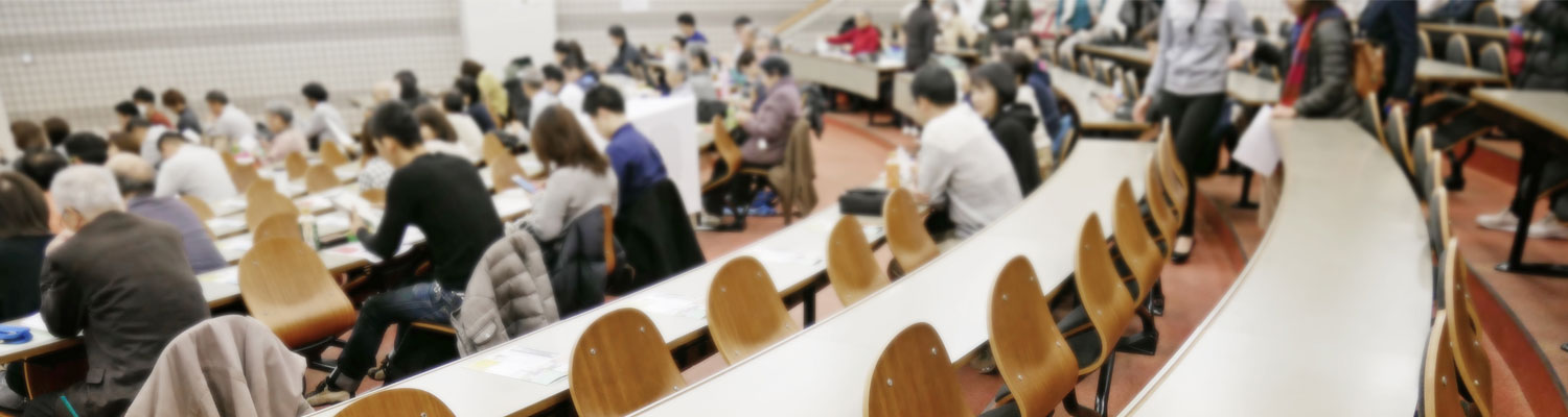 rows of desks in lecture hall
