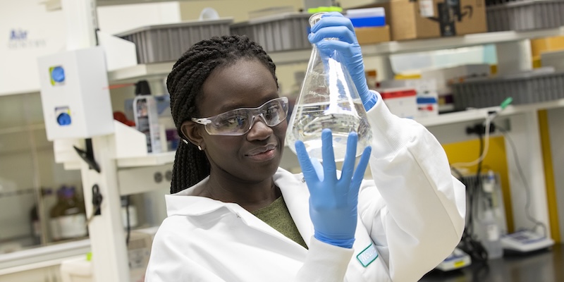Black woman working in a chemistry lab on campus