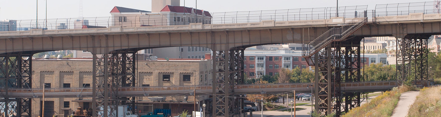 Urban landscape showing elevated bridges and mixed-use buildings in Milwaukee