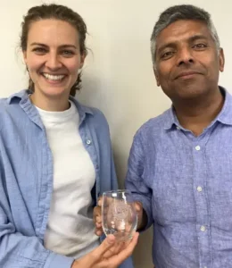 Prof. Stockburger was gifted a special UWM glass by Kundan Kishor, Chair